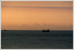 Boat seen from Ipanema at sunrise.