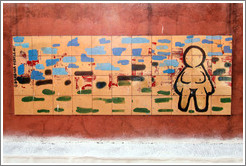 Artwork: woman with no clothes or hair.  Wall surrounding the Cemit?o S?Paulo.