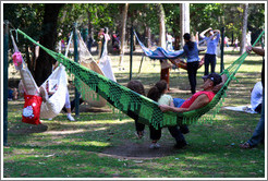 People relaxing in hammocks.  Parque do Ibirapuera.