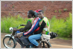 Three men on a motorcycle on Route N5.