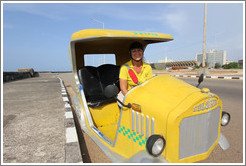 Alba, driver of a Coco taxi, on the Malec&oacute;n.