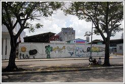 Graffiti of a fish/person/bee with the words "el gran zoo" ("the big zoo"), a robot, and other creatures, Avenida Salvador Allende (Carlos III).
