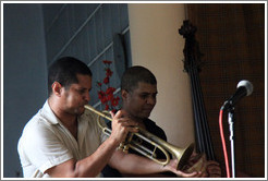 Trumpet player Yasek Manzano Silva and double bassist Omar Gonzales, performing at a private home in Miramar.