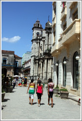 Three women walking down Calle Empedrado, Old Havana.