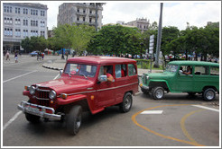 Red and green cars, Paseo del Prado.