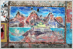 Painting of mountains on a wall.