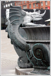 Dragon-like figure on fountain in front of R?us (Town Hall).