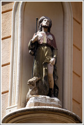Oratory on a building at the intersection of Rue Cardinale and Rue d'Italie.  Depicts a man, possibly with a hare. Quartier Mazarin.