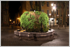 Fontaine d'eau Chaude (Warm Water Fountain) at night.  Built in 1734, fed by a hot spring.  Cours Mirabeau.