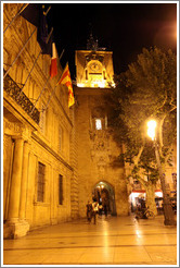 Clock tower, the former town belfry, containing an astronomical clock dating from 1661, at night.  Adjoining the H? de ville (city hall).