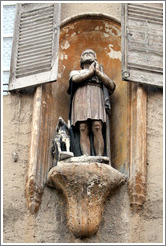 Oratory depicting a man and a dog.  Rue Espariat at Rue de la Masse.  Old town.