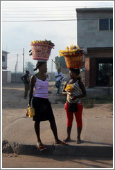 Women with baskets on their heads.