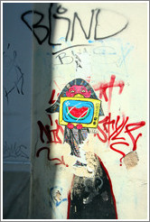 Graffiti depicting a girl holding a television set displaying a bitten watermelon slice.
