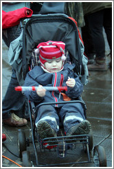 Reykjavik protest.  Child with a recorder (wind instrument).