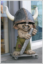 Viking troll outside storefront.