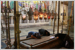Stone of Unction, believed to be the place where Jesus' body was washed after his death.  Church of the Holy Sepulchre, Christian Quarter, Old City of Jerusalem.