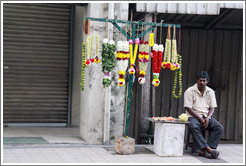 Man selling flower wreaths, Jalan Tun HS Lee.