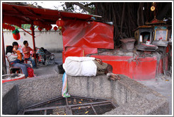Man sleeping outside Kuan Yin Teng (Temple of the Goddess of Mercy).