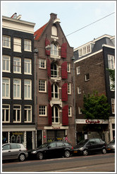 Building with red shutters and Manzano Restaurant.  Rozengracht, Jordaan district.
