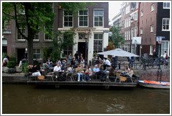 Restaurant with floating outdoor patio.  Egelantiersgracht canal, Jordaan district.