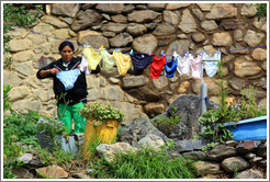 Woman hanging underwear to dry.