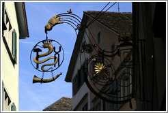 Shop sign with snake wearing crown.  Altstadt (Old Town).